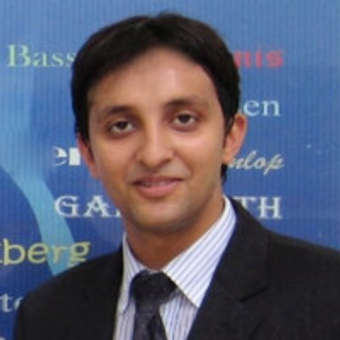Maneesh Dhooper-logo